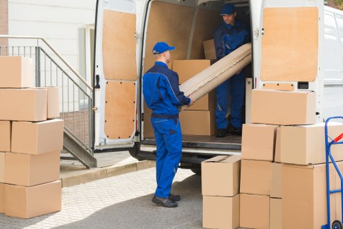 Removal team preparing boxes and furniture safely before a move