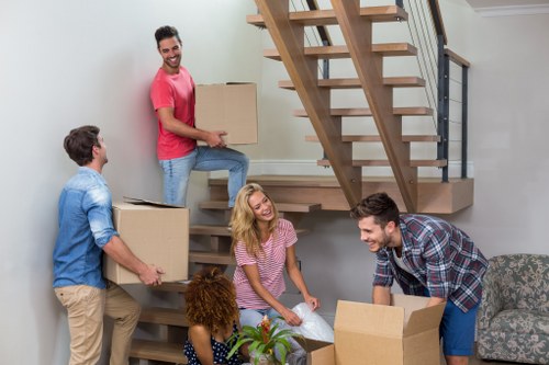 Careful wrapping of fragile household items during packing services