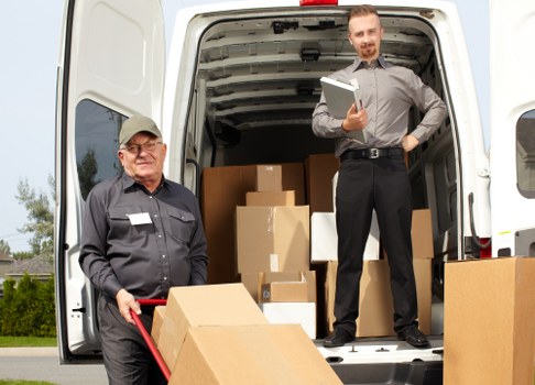 Man with van loading furniture in Shepherdsbush street