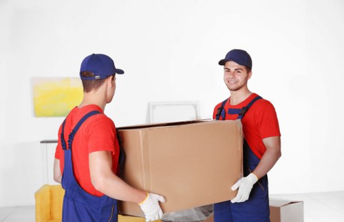 Mover assessing risks and checking access before lifting an item