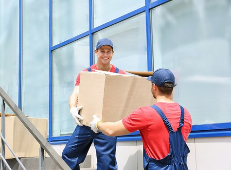 Same day house move in Shepherdsbush with movers carrying belongings