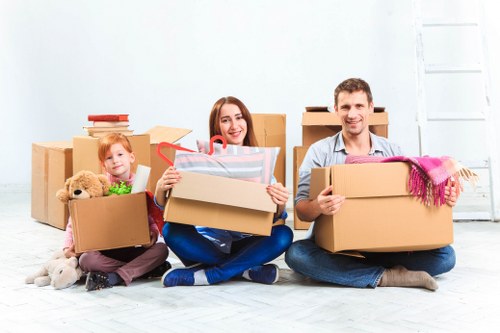 Moving team arranging labeled boxes for efficient Shepherdsbush relocation