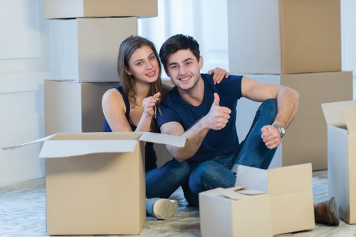 Professional removals team handling furniture in Shepherds Bush