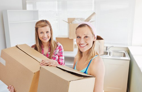 Packed household items being handled with care during relocation